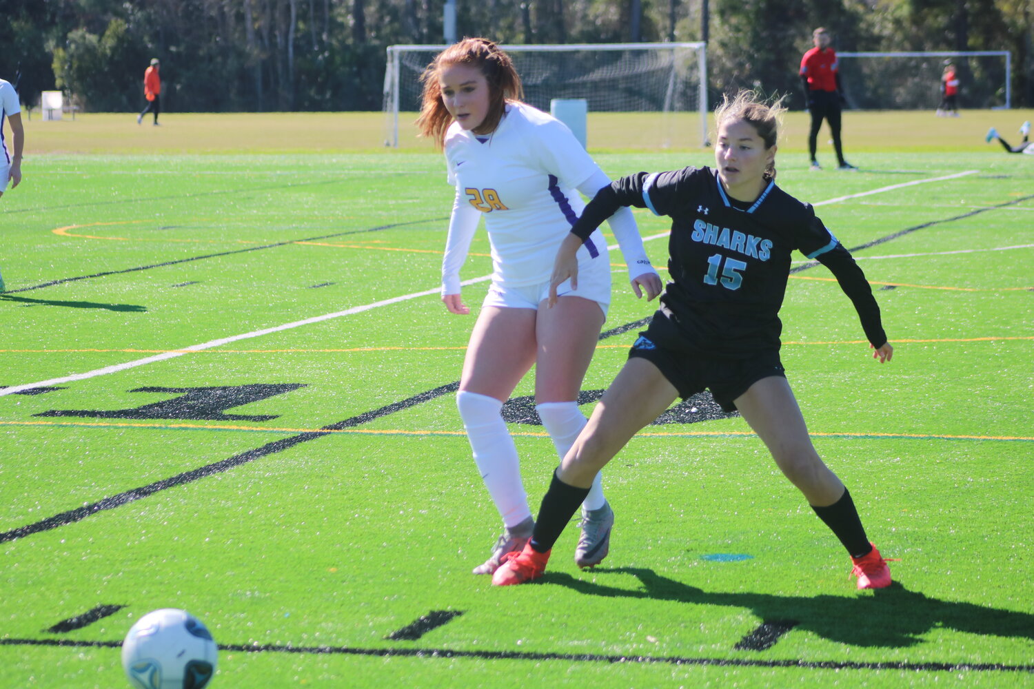 Grace Raymond of Ponte Vedra (No. 15) prepares for a ball coming her way.